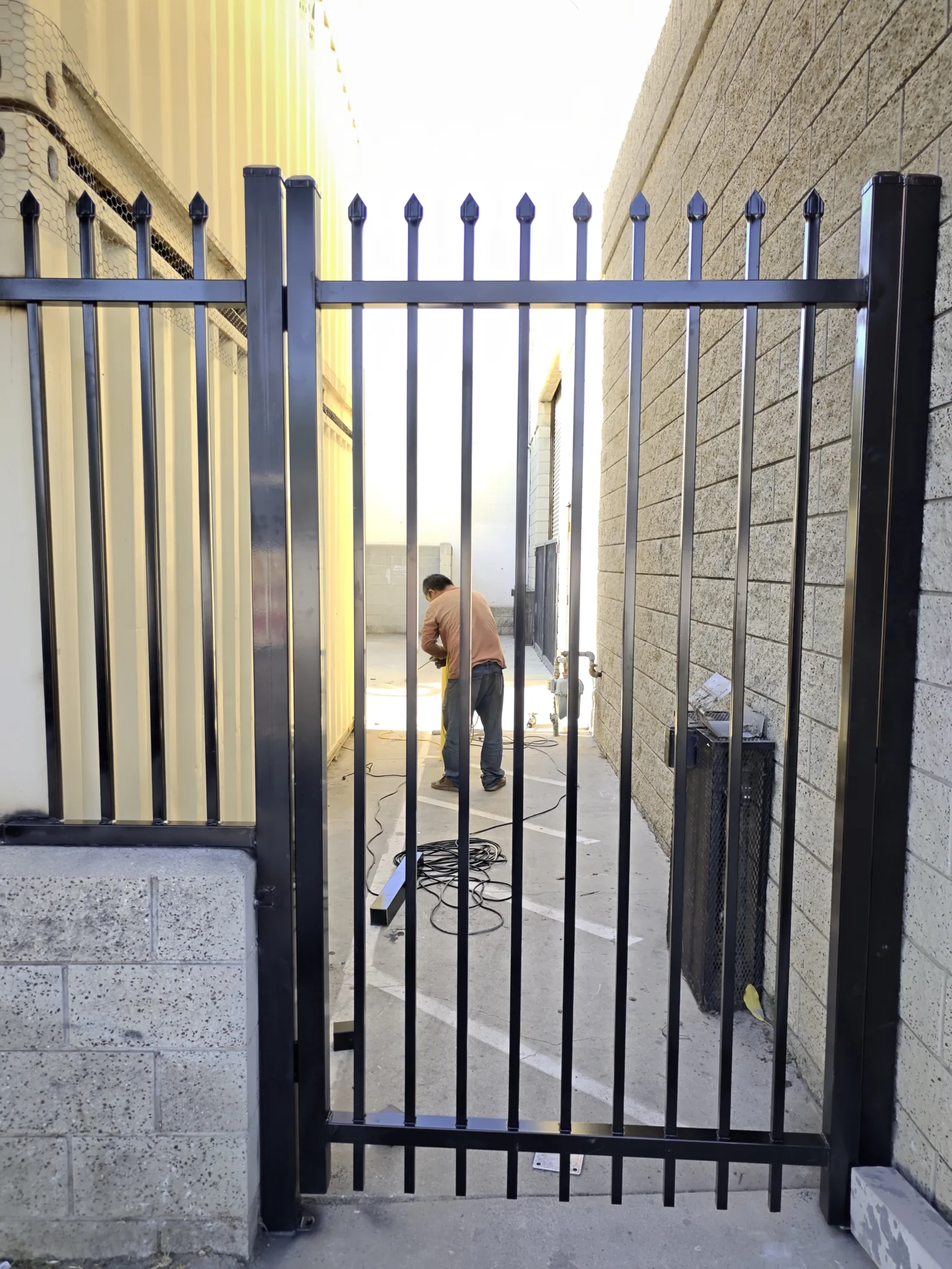 6-foot pedestrian steel swing gate with cane bolt and spear-top pickets in Los Angeles