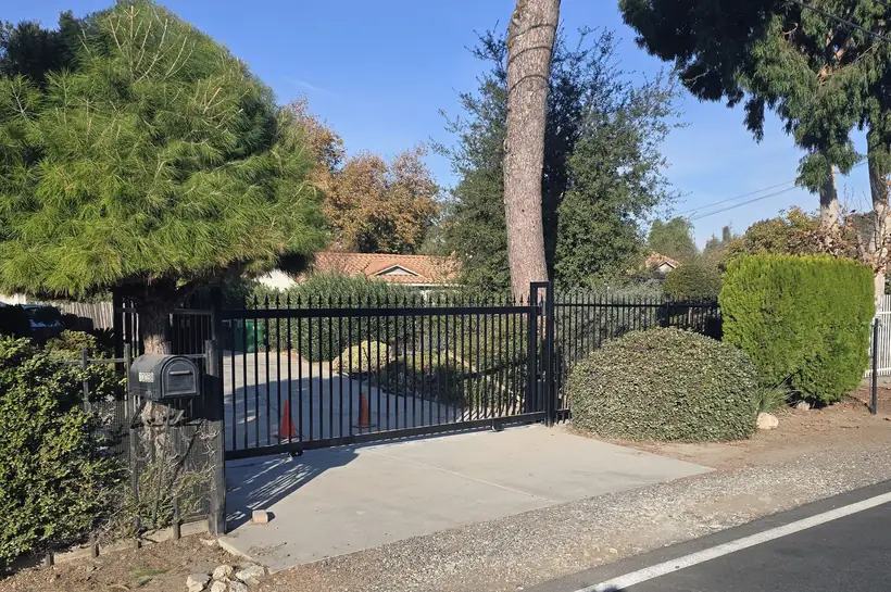 Wrought iron sliding entry gate installed in El Monte, CA by Apexguard Fence