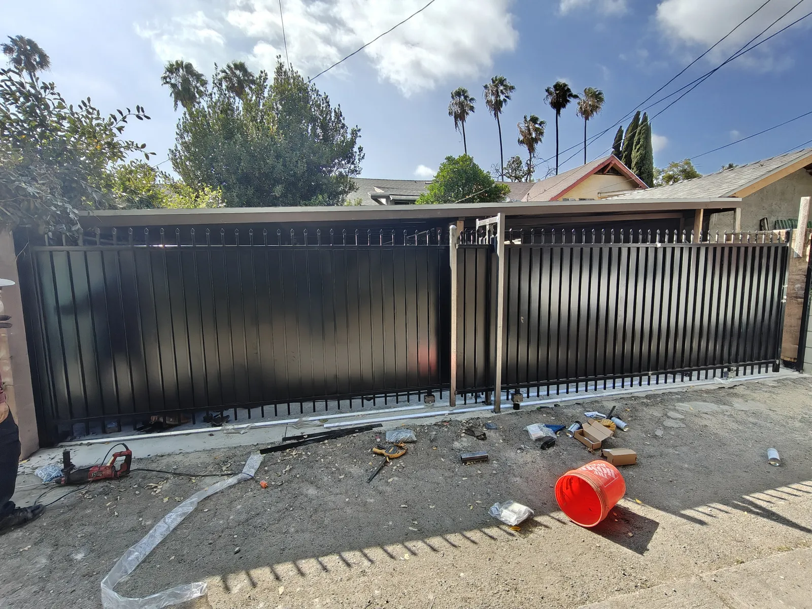 Dual sliding iron driveway gates — a real Apexguard Fence project in Los Angeles, the same build we install in La Habra, CA