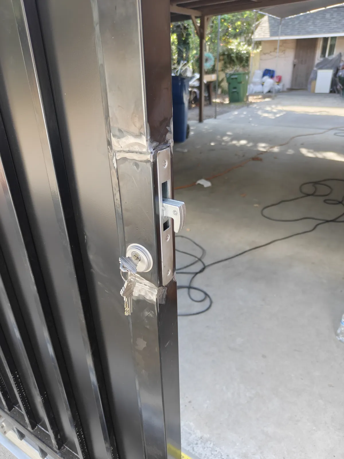 Separate keyed hook lock for each tenant on a sliding gate in Los Angeles