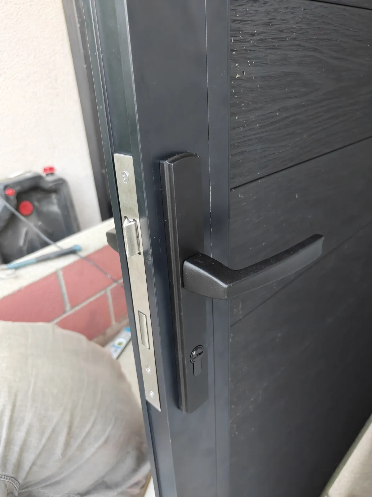 Stainless steel handle and lock on a composite WPC gate by Apexguard Fence