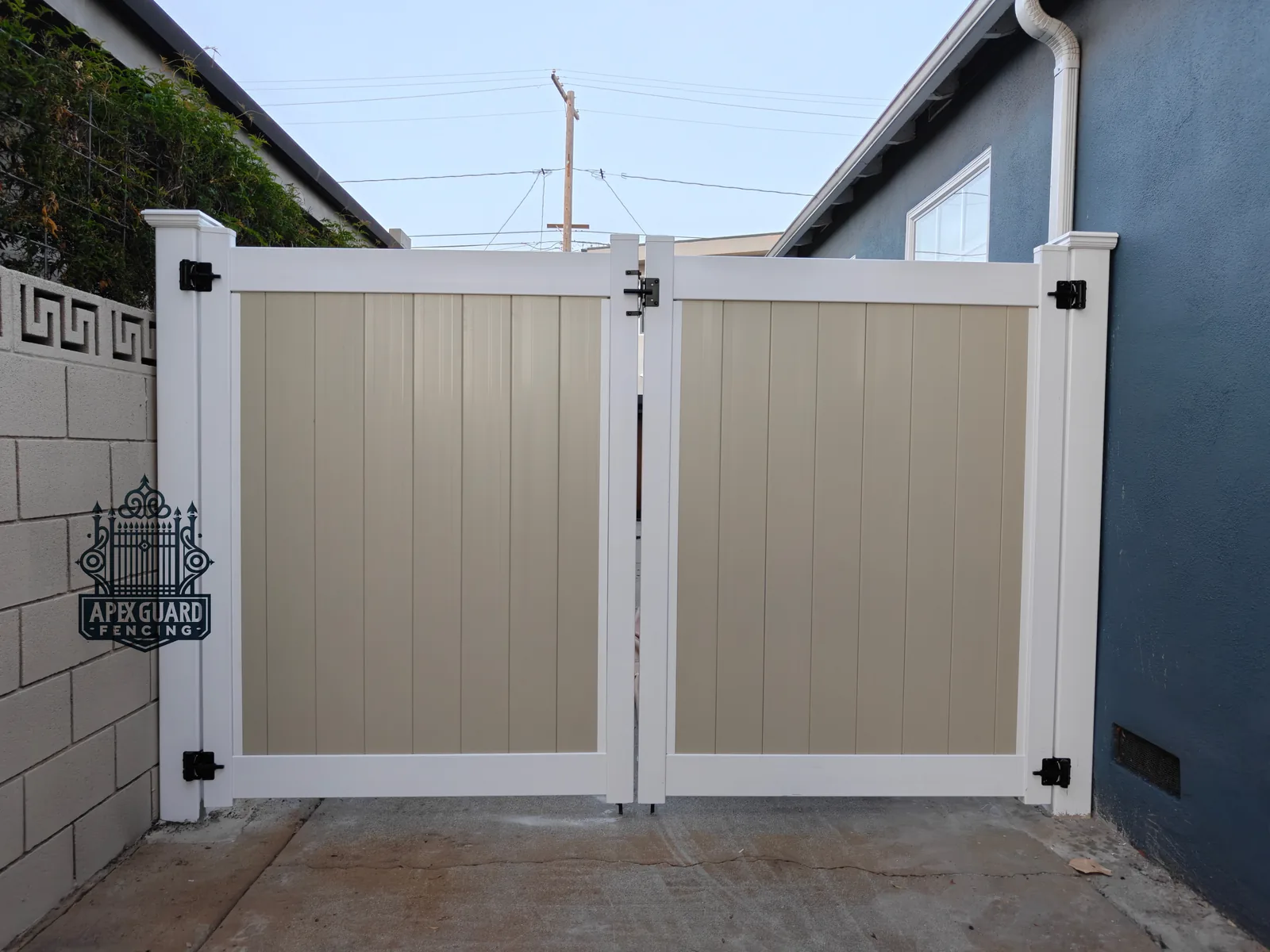 Tan vinyl drive gate installed by Apexguard Fence in Rowland Heights, CA
