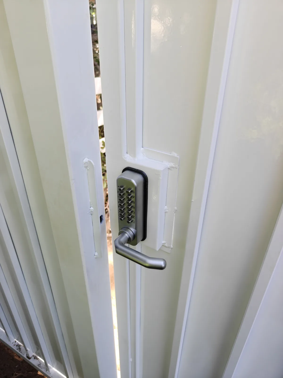 Mechanical keypad lock on the steel walk gate in West Covina, CA by Apexguard Fence