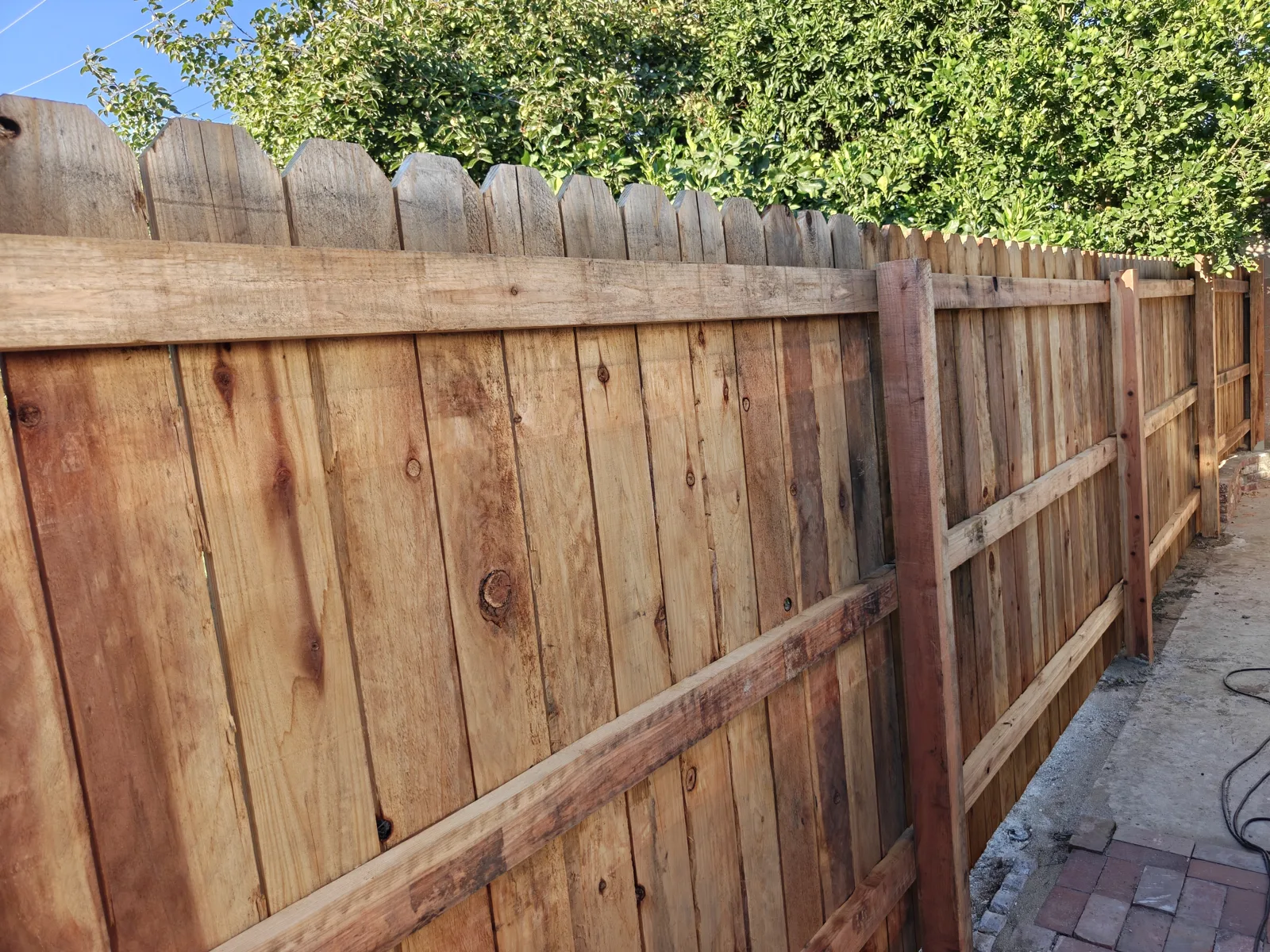 Close-up of dog-ear wood fence boards and rails built in Claremont, CA by Apexguard Fence